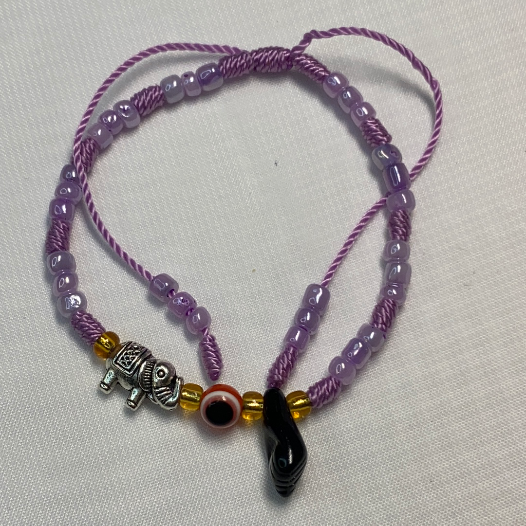 Purple Bracelet With Azabache And Charms