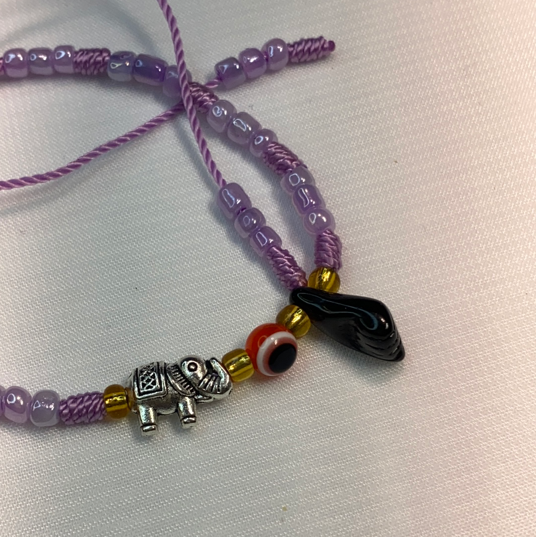 Purple Bracelet With Azabache And Charms