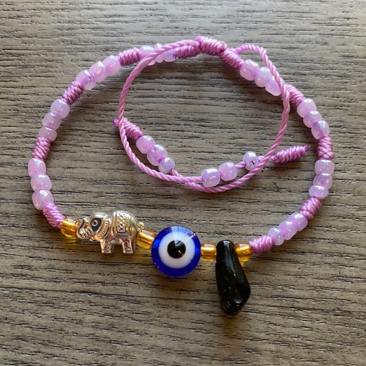 Purple Bracelet With Azabache and Charms