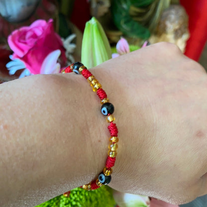 Red Bracelet with Black Evil Eye