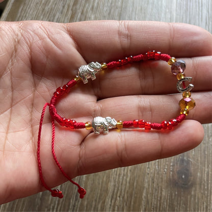 Red Bracelet With Good Luck Charms