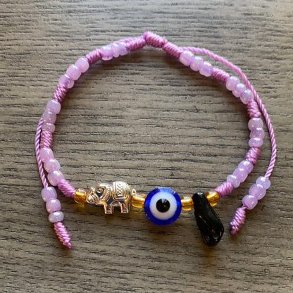Purple Bracelet With Azabache and Charms