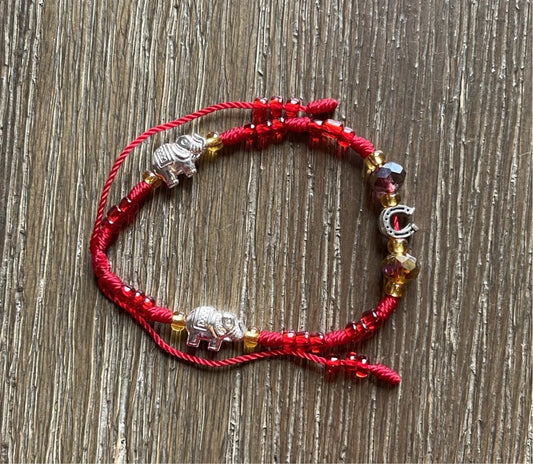 Red Bracelet With Good Luck Charms